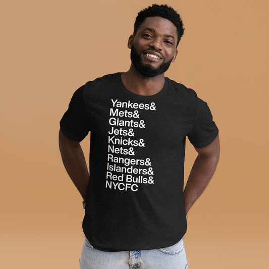 Man in black t-shirt with white lettering reading Yankees and Mets and Giants and Jets and Knicks and Nets and Rangers and Islanders and Red Bulls and NYCFC