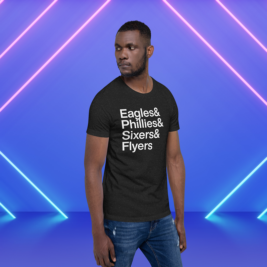 Man on stage wearing black t-shirt with white lettering reading Eagles and Phillies and Sixers and Flyers