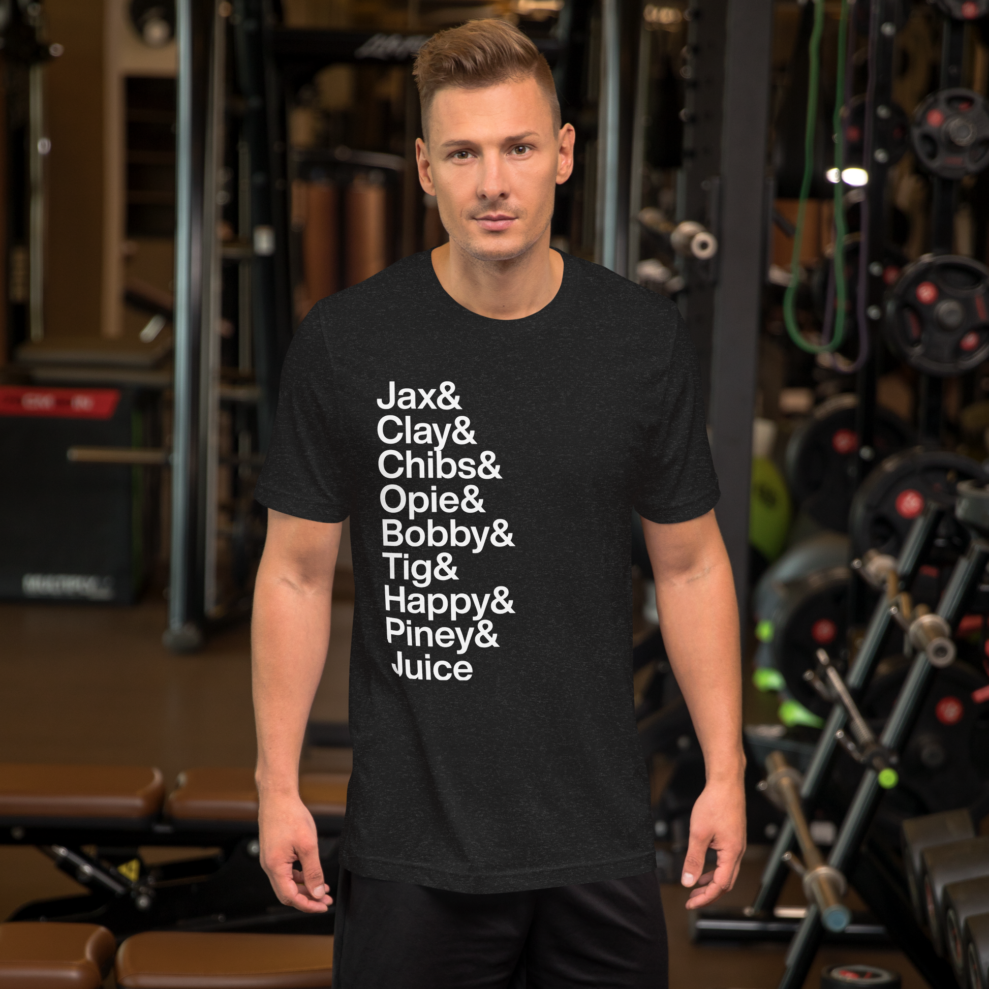 Guy at gym wearing a black t-shirt with white lettering reading Jax and Clay and Chibs and Opie and Bobby and Tig and Happy and Piney and Juice