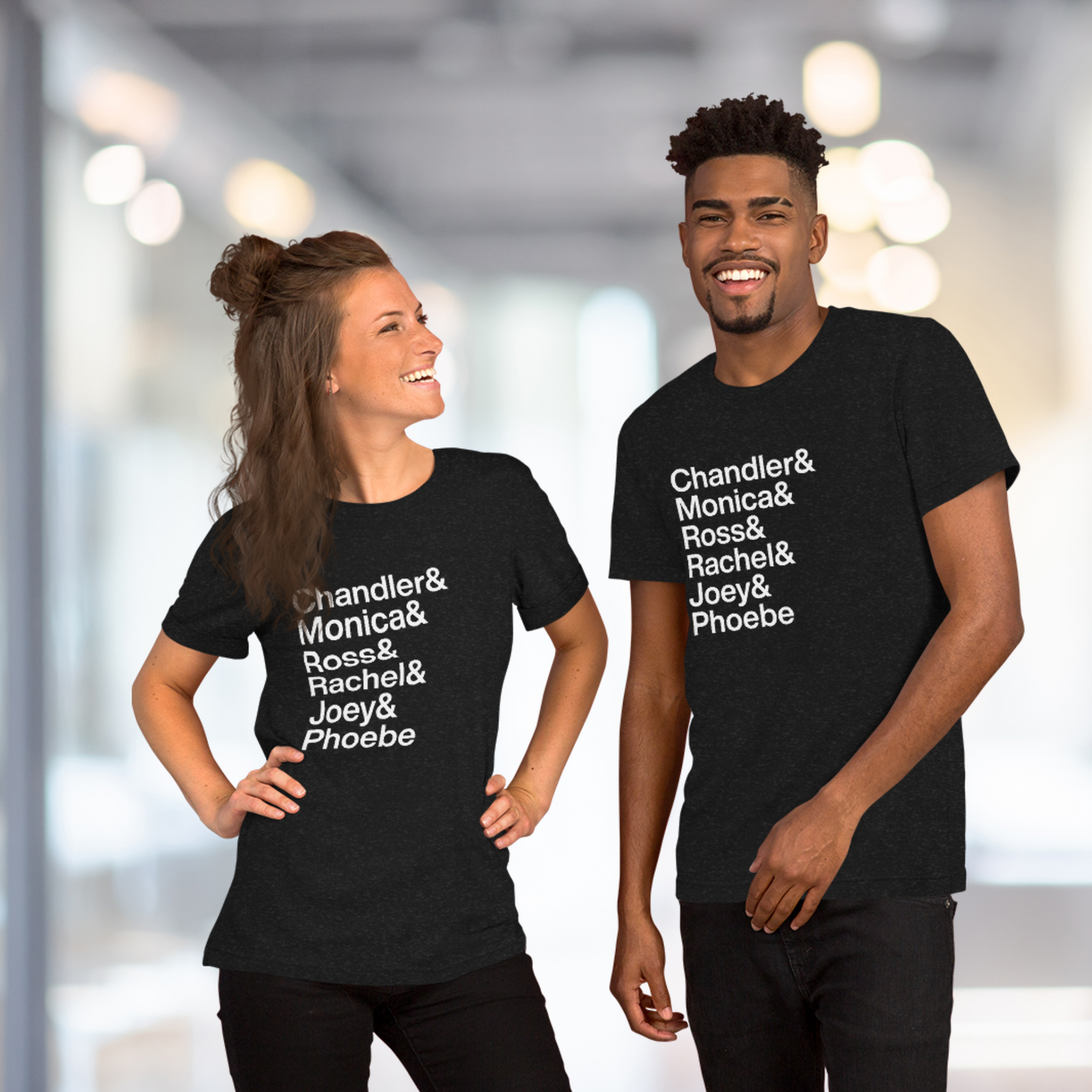 Two friends wearing black t-shirts with white lettering depicting the Friends characters