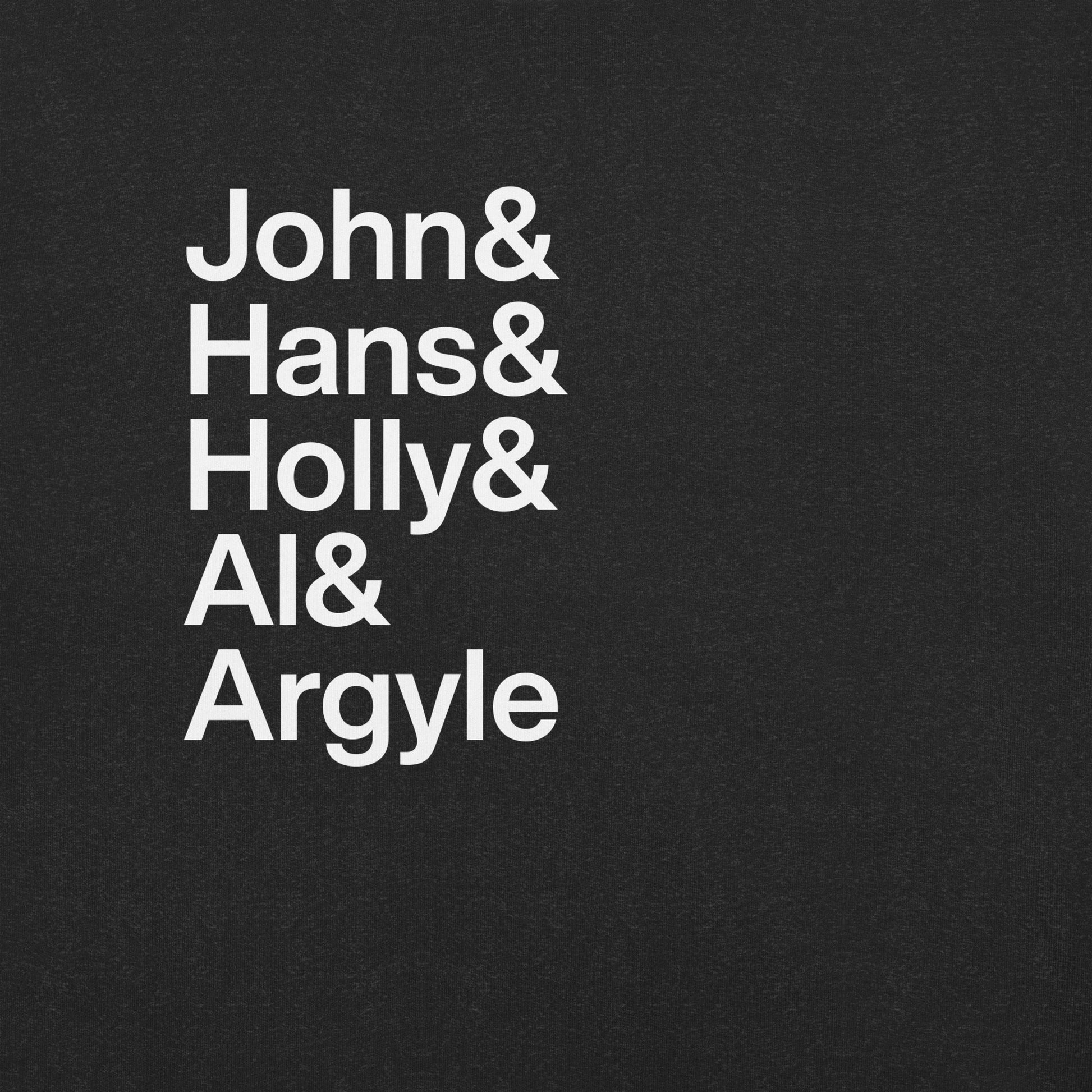Close up of black t-shirt with white lettering depicting characters from Die Hard