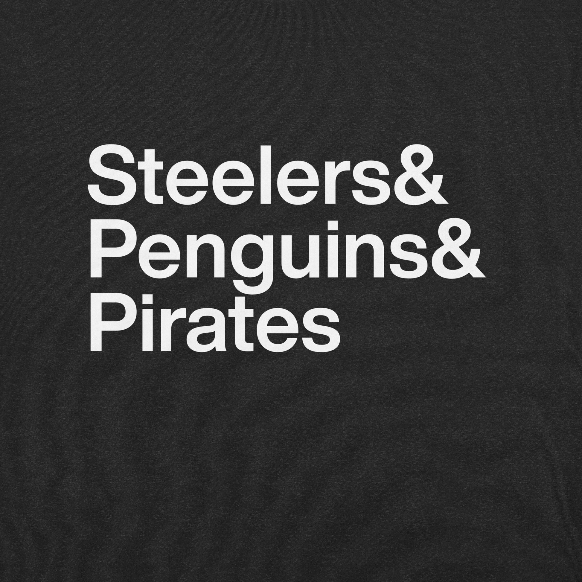 Close up of a black t-shirt with white lettering reading Steelers and Penguins and Pirates