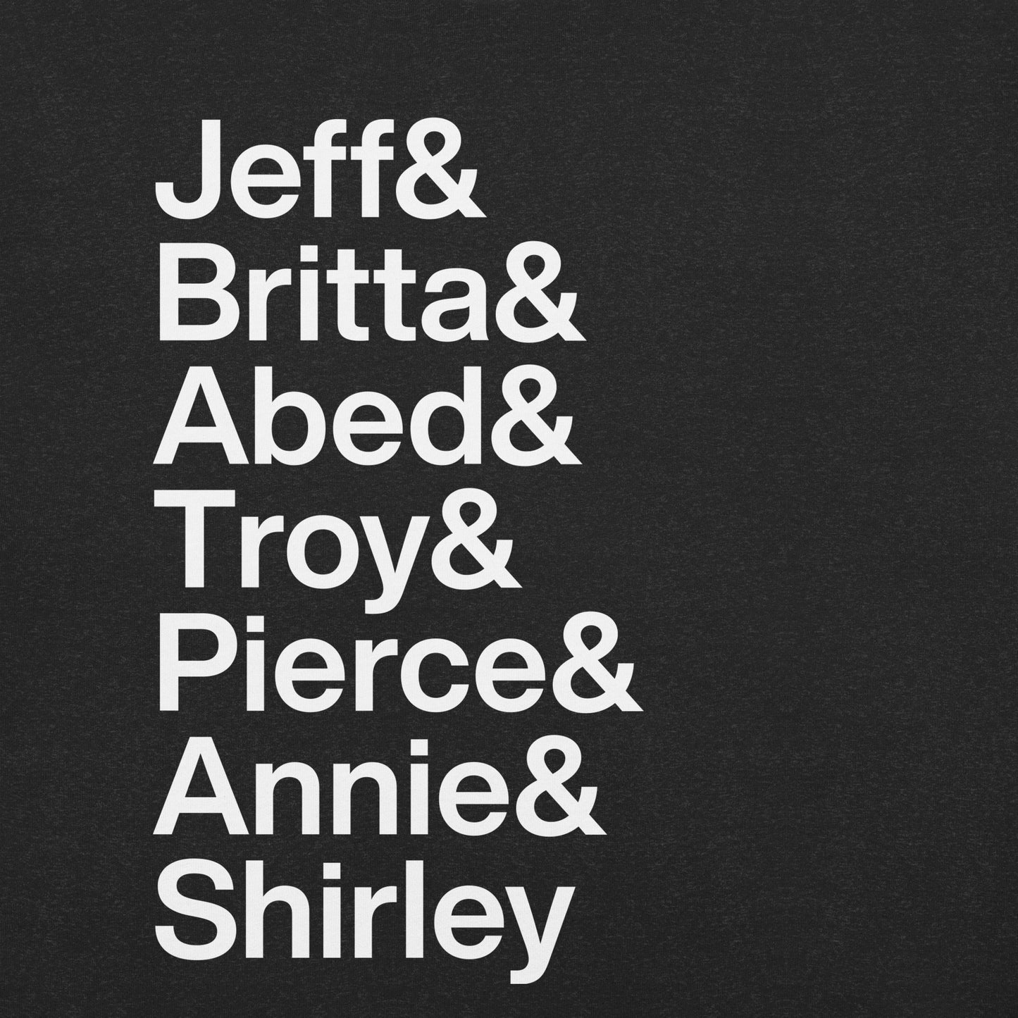 Close up of black t-shirt with white lettering reading Jeff and Britta and Abed and Troy and Pierce and Annie and Shirley