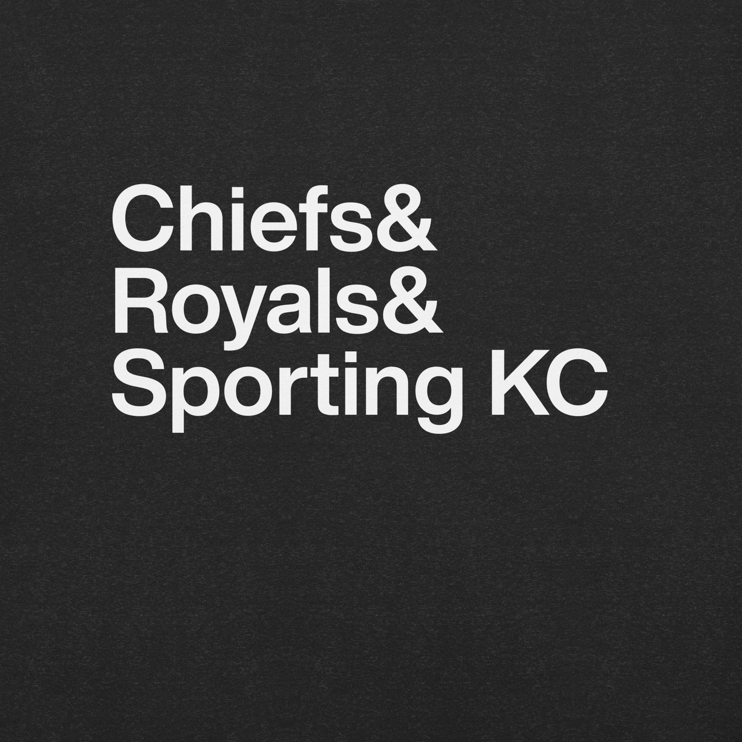 Close up of black t-shirt with white lettering reading Chiefs and Royals and Sporting KC