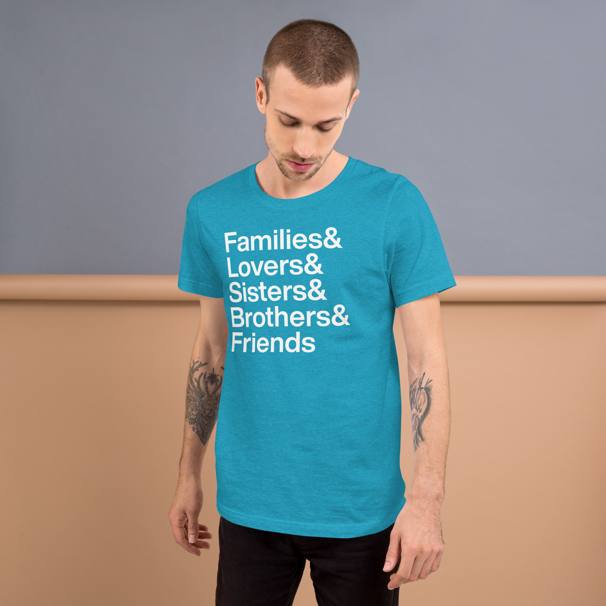 Man wearing a blue t-shirt with white text on a plain background